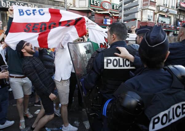 England fans gather outside a bar in Lille. Picture: AP