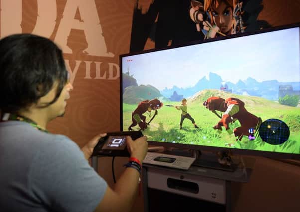 Gamers try out new video games at the annual E3 gaming conference at the Los Angeles Convention Center. Picture Kevork Djansezian/Getty Images