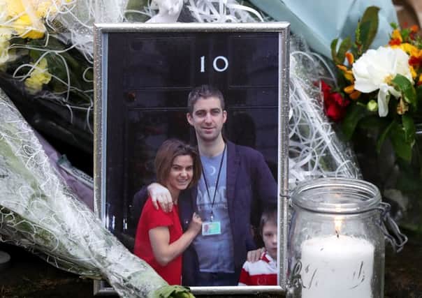 A photograph of Jo Cox and her family at 10 Downing Street was among the tributes left in Birstall. Picture: Getty Images