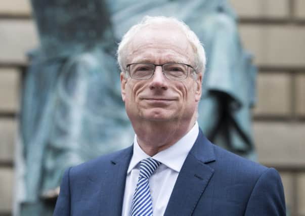 Lord Smith, pictured in front of the Hume statue on the Royal Mile during a visit to Edinburgh last week, said that Scottish complaints to the ASA total just 6 per cent of total gripes UK-wide. Picture: Ian Rutherford
