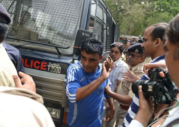 One of those convicted over religious rioting arrives for sentencing in Ahmedabad. Picture: AFP/Getty Images