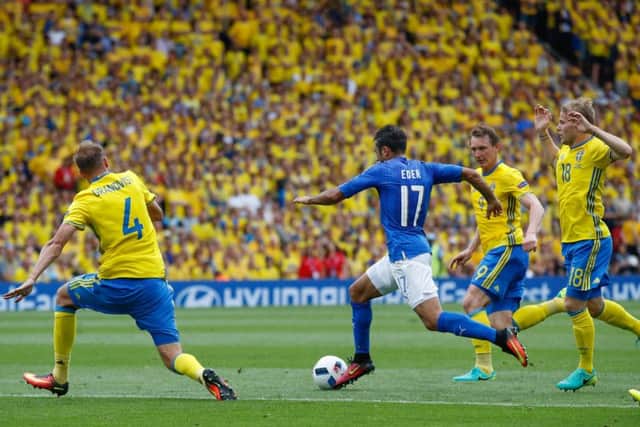 Italy's Eder dribbles through the Sweden defence before scoring the late winner. Picture: Andrew Medichini/AP