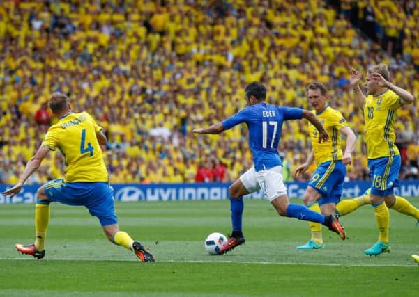 Italy's Eder dribbles through the Sweden defence before scoring the late winner. Picture: Andrew Medichini/AP
