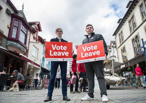 Tory supporter Oliver Coulson and Labour supporter Harry Edwards join forces. Picture John Devlin