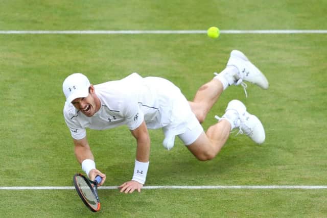 Andy Murray slips over as he reaches for the ball in his quarter final match against Kyle Edmund. Picture: Richard Heathcote/Getty Images