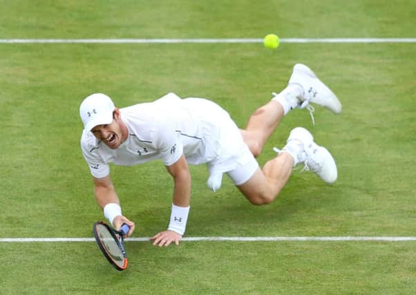 Andy Murray slips over as he reaches for the ball in his quarter final match against Kyle Edmund.  Picture: Richard Heathcote/Getty Images