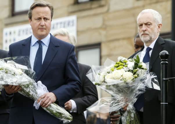 Prime Minister David Cameron and Labour Party leader Jeremy Corbyn lay flowers to tribute Jo Cox MP. Picture: Danny Lawson/PA Wire