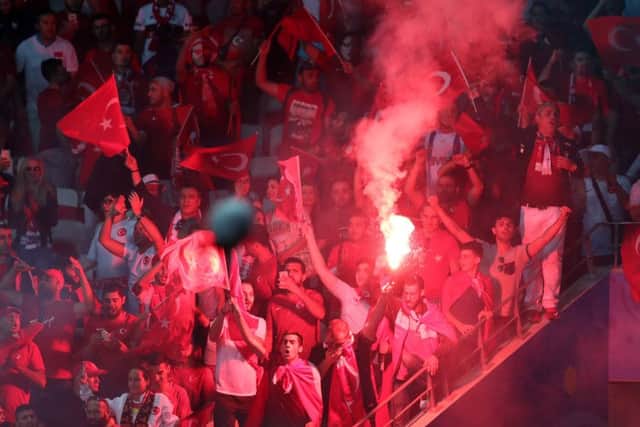 Turkey's fans light flares during the Euro 2016 Group D match against Spain. Picture: AP