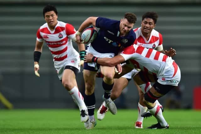 Duncan Taylor tries to get a Scottish attack going but is outnumbered by defenders. Photograph: Getty Images