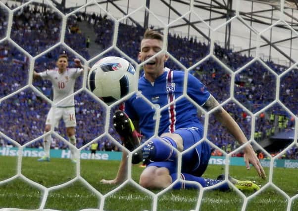 Iceland's Birkir Saevarsson scores an own goal during the Euro 2016 Group F match between Iceland and Hungary in Marseille Picture: Ariel Schalit/AP