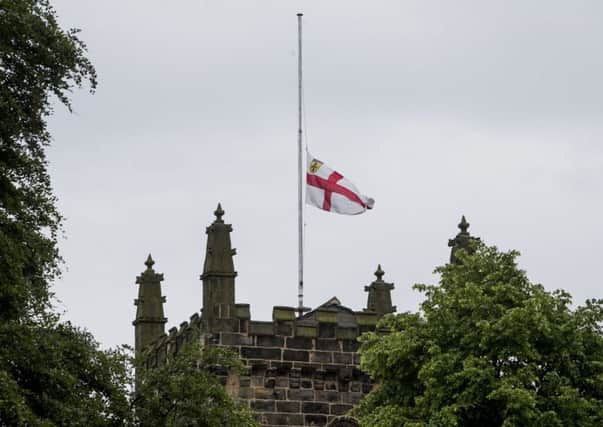 A flag flying at half-mast at St Peters Church, Birstall, where a service was held to remember the life of the towns MP, Jo Cox. Picture: PA