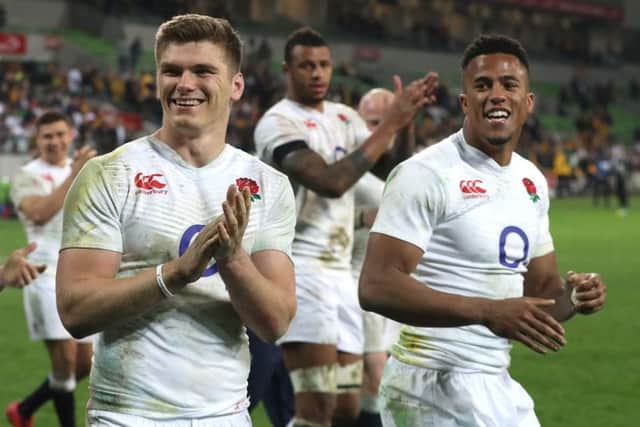 Owen Farrell, left, celebrates with his team mates after their victory over the Wallabies in Melbourne. Picture: Getty Images