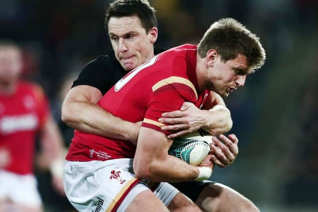 Wales stand-off Dan Biggar is tackled by Ben Smith during the All Blacks win in Wellington. Picture: Getty Images