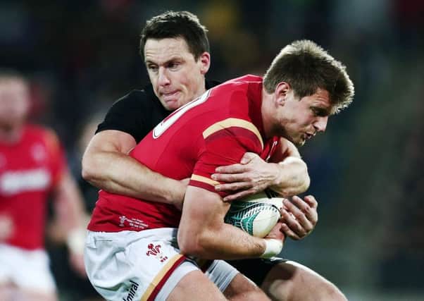 Wales stand-off Dan Biggar is tackled by Ben Smith during the All Blacks win in Wellington. Picture: Getty Images