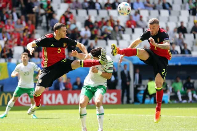 Shane Long appears to take a boot in the face as he and defenders Thomas Vermaelen and Toby Alderweireld challenge for the ball. Picture: PA