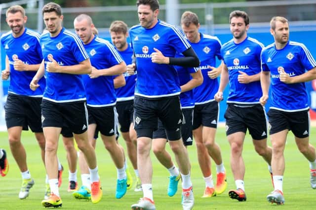 The Northern Ireland squad, including Aberdeens Niall McGinn, far right, are put through their paces ahead of tomorrows showdown. Picture: PA