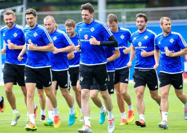 The Northern Ireland squad, including Aberdeens Niall McGinn, far right, are put through their paces ahead of tomorrows showdown. Picture: PA