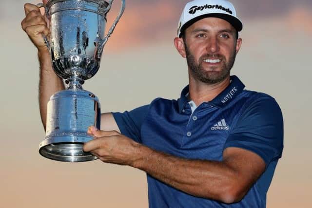 Dustin Johnson holds aloft the US Open trophy after his win at Oakmont. Picture: Getty Images