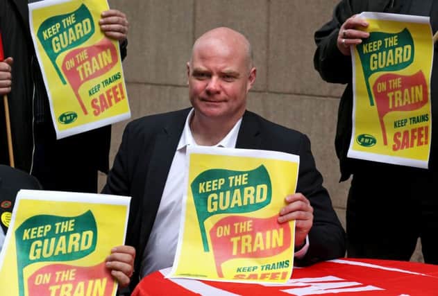 Steve Hedley of the RMT union takes part in a demonstration outside ScotRail HQ in Glasgow. Picture: PA