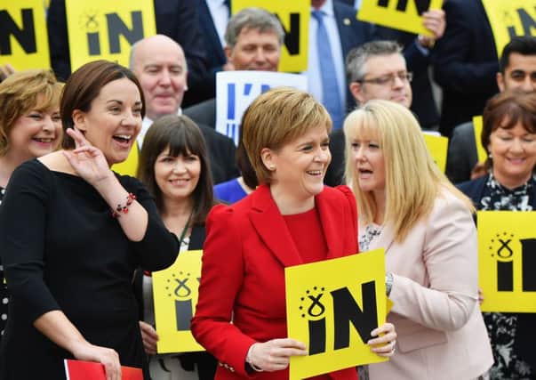 Nicola Sturgeon flanked by Kezia Dugdale and other pro-EU MSPs gather outsdie the Scottish Parliament. Picture: Getty Images