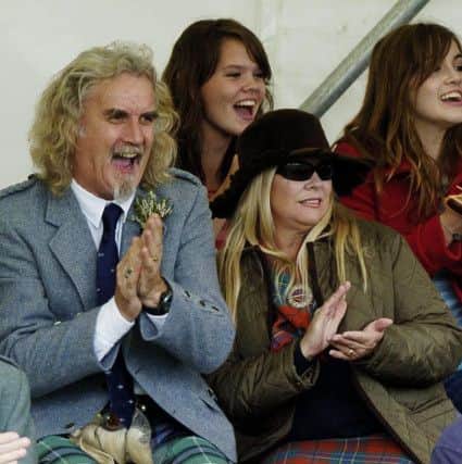 Comedian Billy Connolly and wife Pamela Stephenson at  Lonach Highland Gathering in 2004. PIC: PA Photo/Andrew Milligan