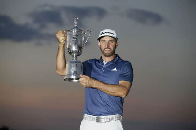 Dustin Johnson holds the trophy after winning the US Open at Oakmont Country Club. Picture: John Minchillo/AP