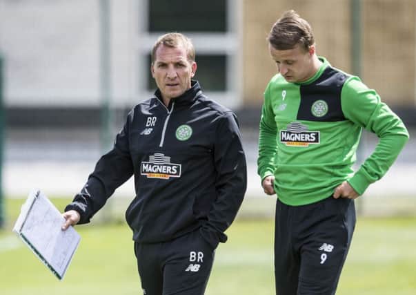 New Celtic manager Brendan Rodgers chats with striker Leigh Griffiths during training at Lennoxtown yesterday. Picture: SNS