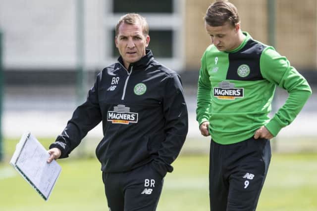 New Celtic manager Brendan Rodgers chats with striker Leigh Griffiths during training at Lennoxtown yesterday. Picture: SNS