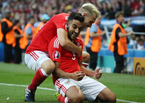 Aaron Ramsey, left, celebrates with Neil Taylor after Taylor had put Wales 2-0 ahead against Russian in Toulouse. Picture: Yegor Aleyev/ Getty Images