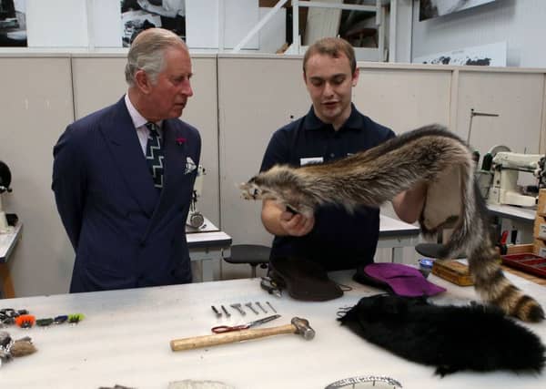 The Duke of Rothesay meets Liam Neil during a visit to sporran-maker Margaret Morrison in Perth, Perthshire. Picture: Andrew Milligan/PA Wire