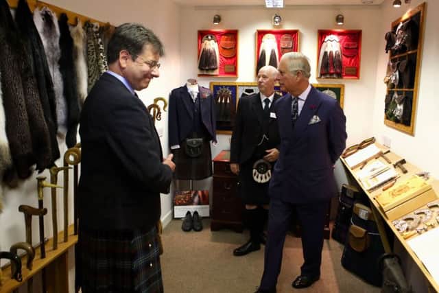 The Duke of Rothesay (right) speaks with chairman of Scottish Tartan authority John McLeish (left) and boss Greg Whyte in the showroom during a visit to sporran-maker Margaret Morrison in Perth, Perthshire. Picture: Andrew Milligan/PA Wire