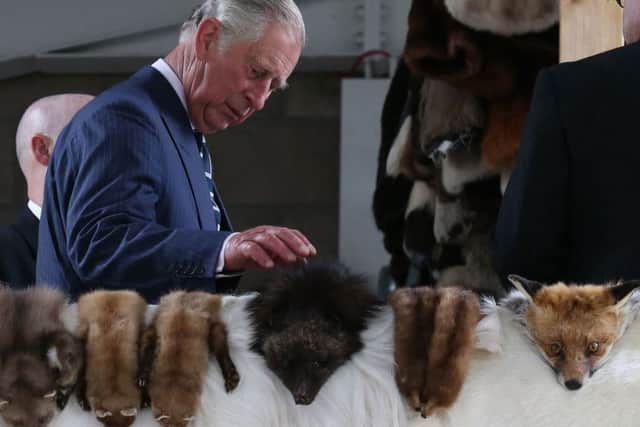 The Duke of Rothesay (centre) looks at furs during a visit to sporran-maker Margaret Morrison in Perth, Perthshire. Picture: Andrew Milligan/PA Wire