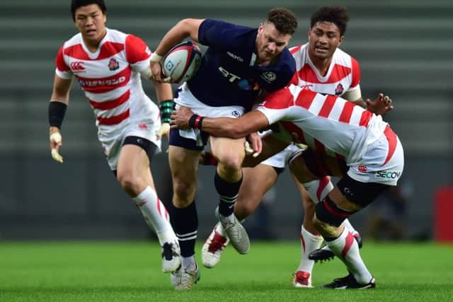 Scotland's Duncan Taylor is tackled during the first Test against Japan at Toyota Stadium. Picture: Atsushi Tomura/Getty