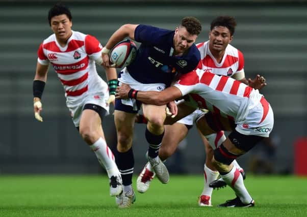 Scotland's Duncan Taylor is tackled  during the first Test against Japan at Toyota Stadium. Picture: Atsushi Tomura/Getty