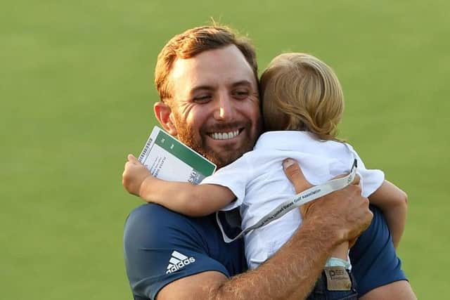 Dustin Johnson celebrates his US Open win with son Tatum. Picture: Getty.