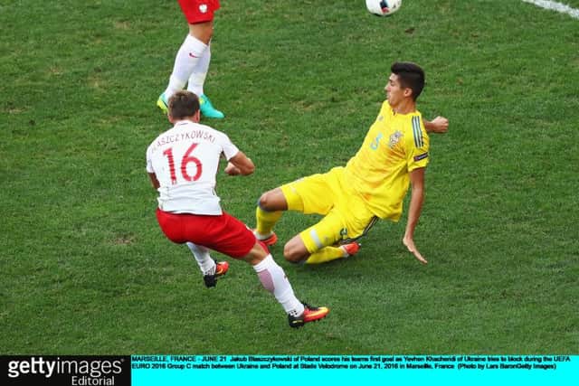 Jakub Blaszczykowski scores Poland's winner against Ukraine. Picture: Lars Baron/Getty Images
