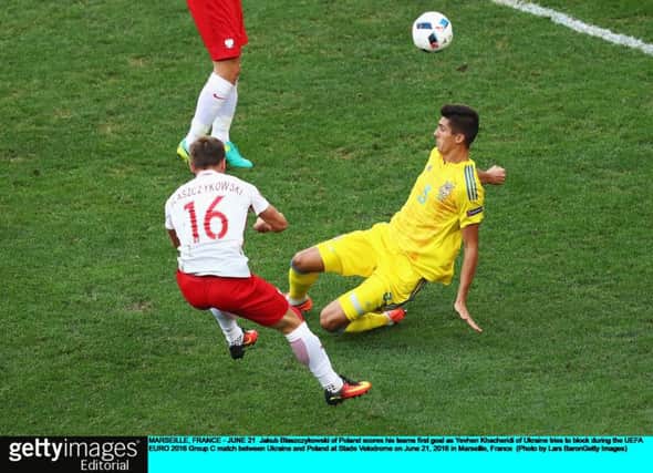 Jakub Blaszczykowski  scores Poland's winner against Ukraine. Picture: Lars Baron/Getty Images