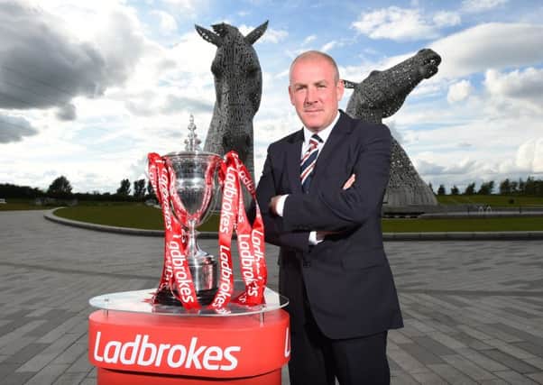 Rangers manager Mark Warburton with the Ladbrokes SPFL Championship trophy at the Kelpies. Picture: Craig Williamson/SNS