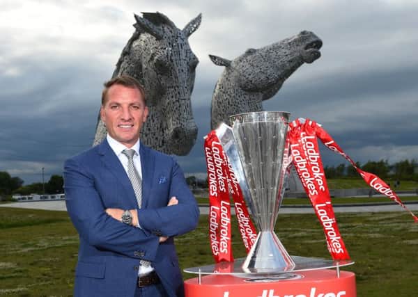 Celtic manager Brendan Rodgers with the Ladbrokes SPFL trophy at the Kelpies. Picture: Craig Williamson/SNS