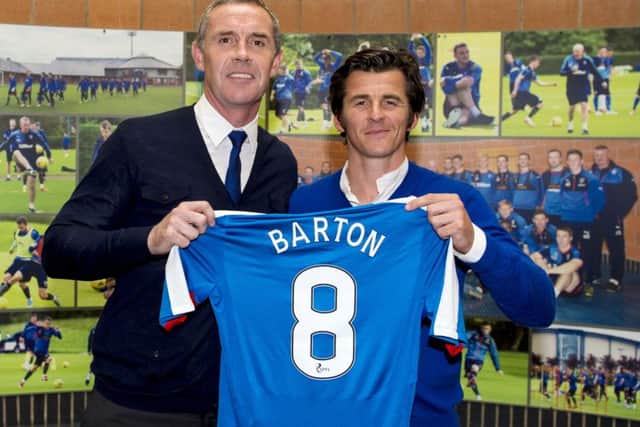 Joey Barton with Rangers assistant manager David Weir. The Old Firm cup semi-final helped lure the midfielder north. Picture: Paul Devlin/SNS