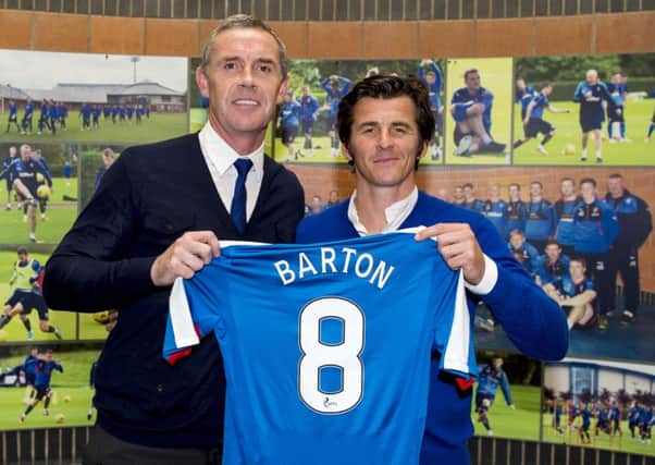 Joey Barton with Rangers assistant manager David Weir. The Old Firm cup semi-final helped lure the midfielder north. Picture: Paul Devlin/SNS