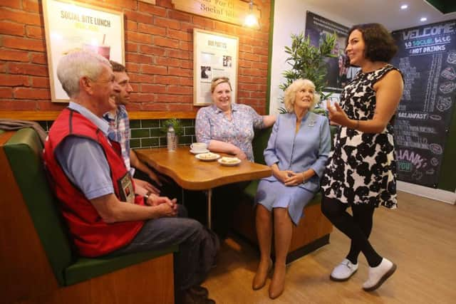 Duchess of Rothesay speaks to Big Issue seller George Whyte (left) and volunteer Zakia Moulaoui (right), during a visit to Social Bite. Picture: Andrew Milligan/PA Wire