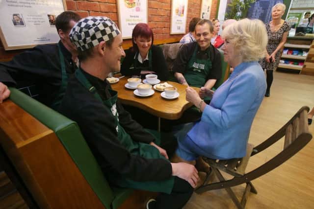 The Duchess of Cornwall, while in Scotland, speaks to Sonny Murray (left) and other employees, during a visit to Social Bite, a cafe in Edinburgh which feeds, trains and employs members of the homeless community. Picture: Andrew Milligan/PA Wire