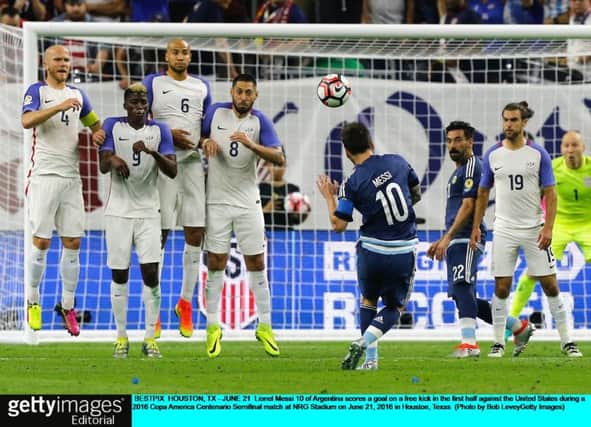 Lionel Messi scores from a free kick in the Copa America semi-final against the US to break the Argentina goalscoring record.  Picture: Bob Levey/Getty Images