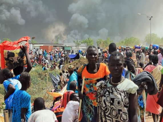 South Sudanese civilians flee fightings in the northeastern town of Malakal. Picture: AFP/Getty