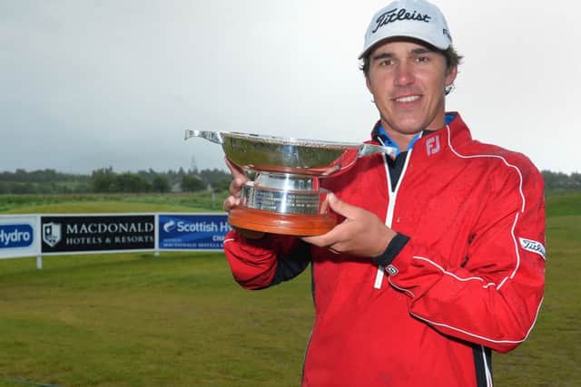AVIEMORE, SCOTLAND - JUNE 23: Brooks Koepka of the USA winner of the Scottish Hydro Challenge hosted by MacDonald Hotels & Resorts lift the trophy at the 18th on June 23, 2013 in Aviemore, Scotland. (Photo by Mark Runnacles/Getty Images)