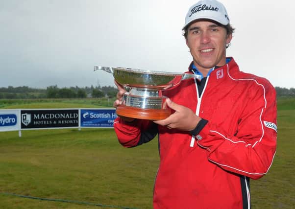 AVIEMORE, SCOTLAND - JUNE 23: Brooks Koepka of the USA winner of the Scottish Hydro Challenge hosted by MacDonald Hotels & Resorts lift the trophy at the 18th on June 23, 2013 in Aviemore, Scotland. (Photo by Mark Runnacles/Getty Images)