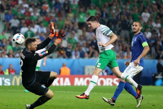 Robbie Brady connects with Wes Hoolahans perfect cross and scores the  dramatic late winner. Picture: Chris Radburn/PA Wire