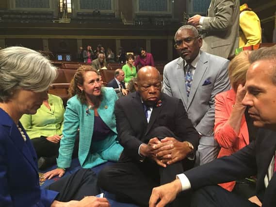 John Lewis, centre, and other members of Congress stage a sit-in on the floor of the US House of Representatives. Picture: Getty