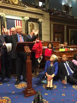 Democrat members of Congress in sit-down protest are seeking a vote on gun control measures. Picture: AP